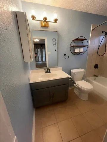 a kitchen with a stove and a microwave