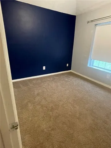 a view of a bench in front of a yard