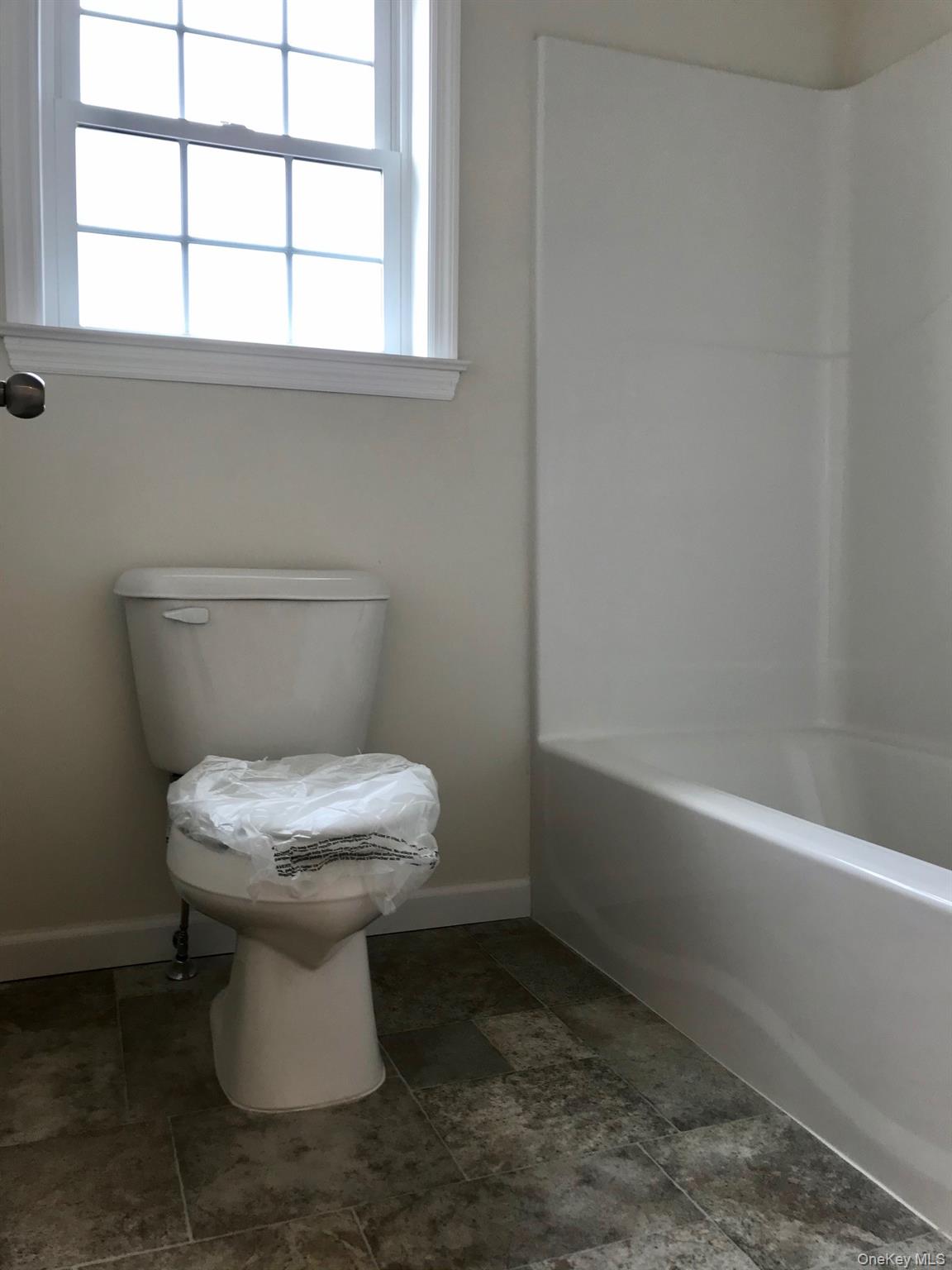 1004 North Division Street, Unit B Peekskill, NY 10566 - Photo 17 of 17 Full bath featuring toilet and bathing tub / shower combination