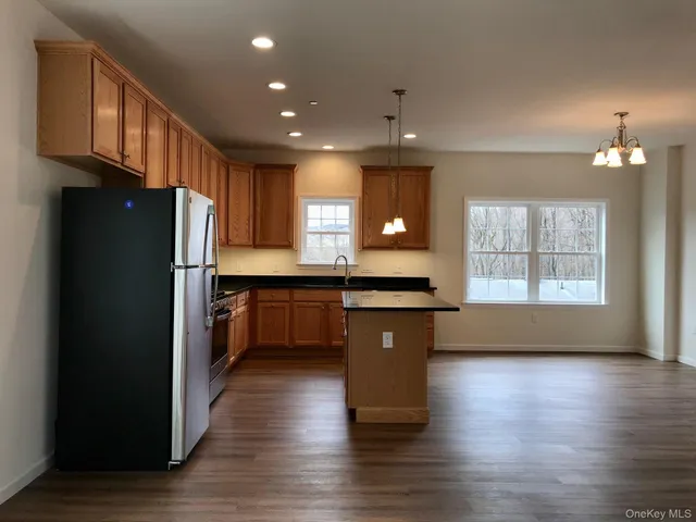 a kitchen with counter top space and refrigerator
