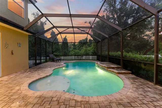 a view of a swimming pool with a patio