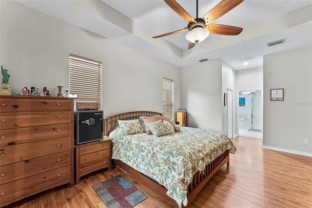 a bedroom with a bed and a dresser