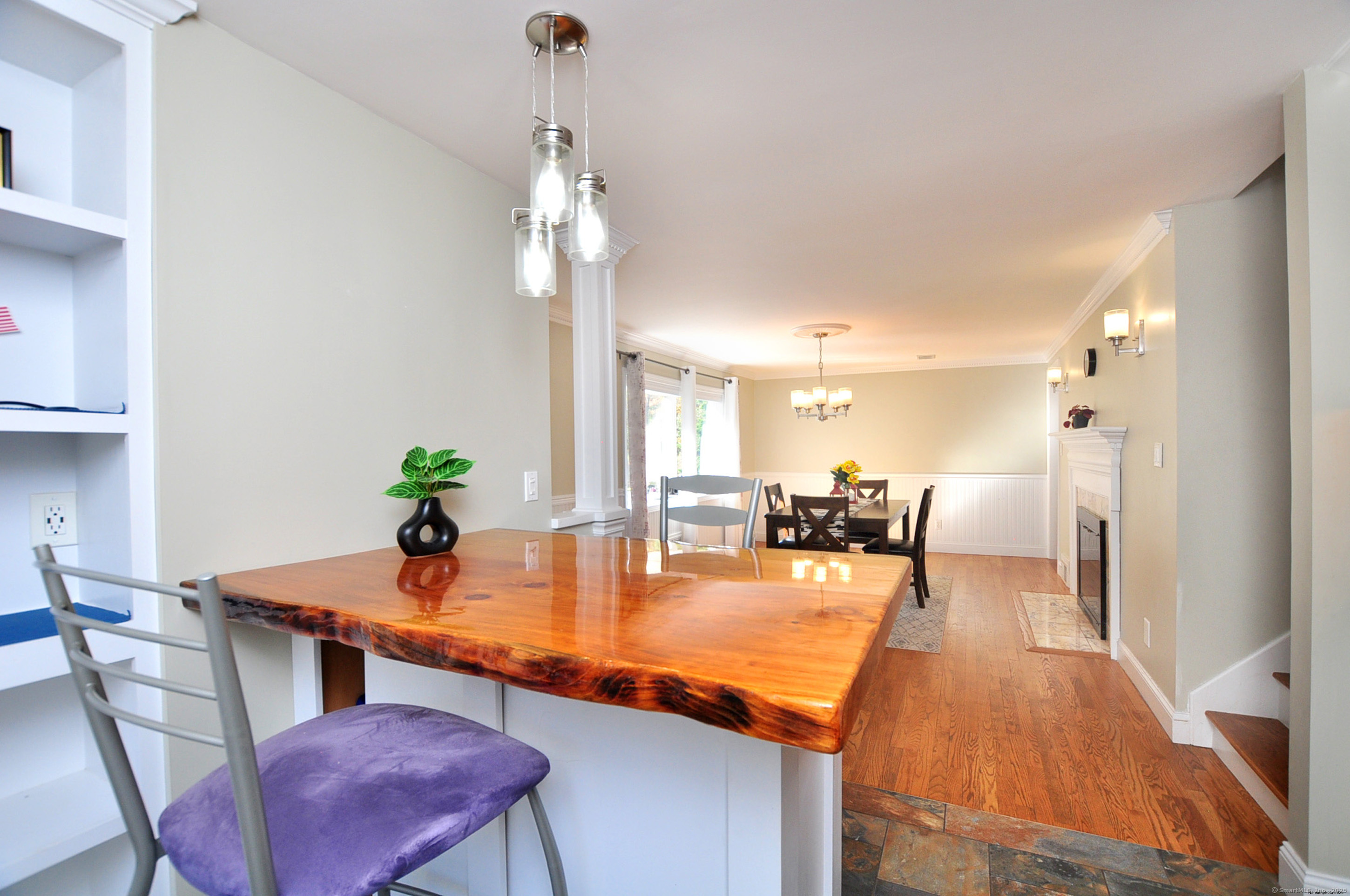 274 Smith Street South Windsor, CT 06074 - Photo 14 of 38 a dining room with furniture a chandelier and wooden floor
