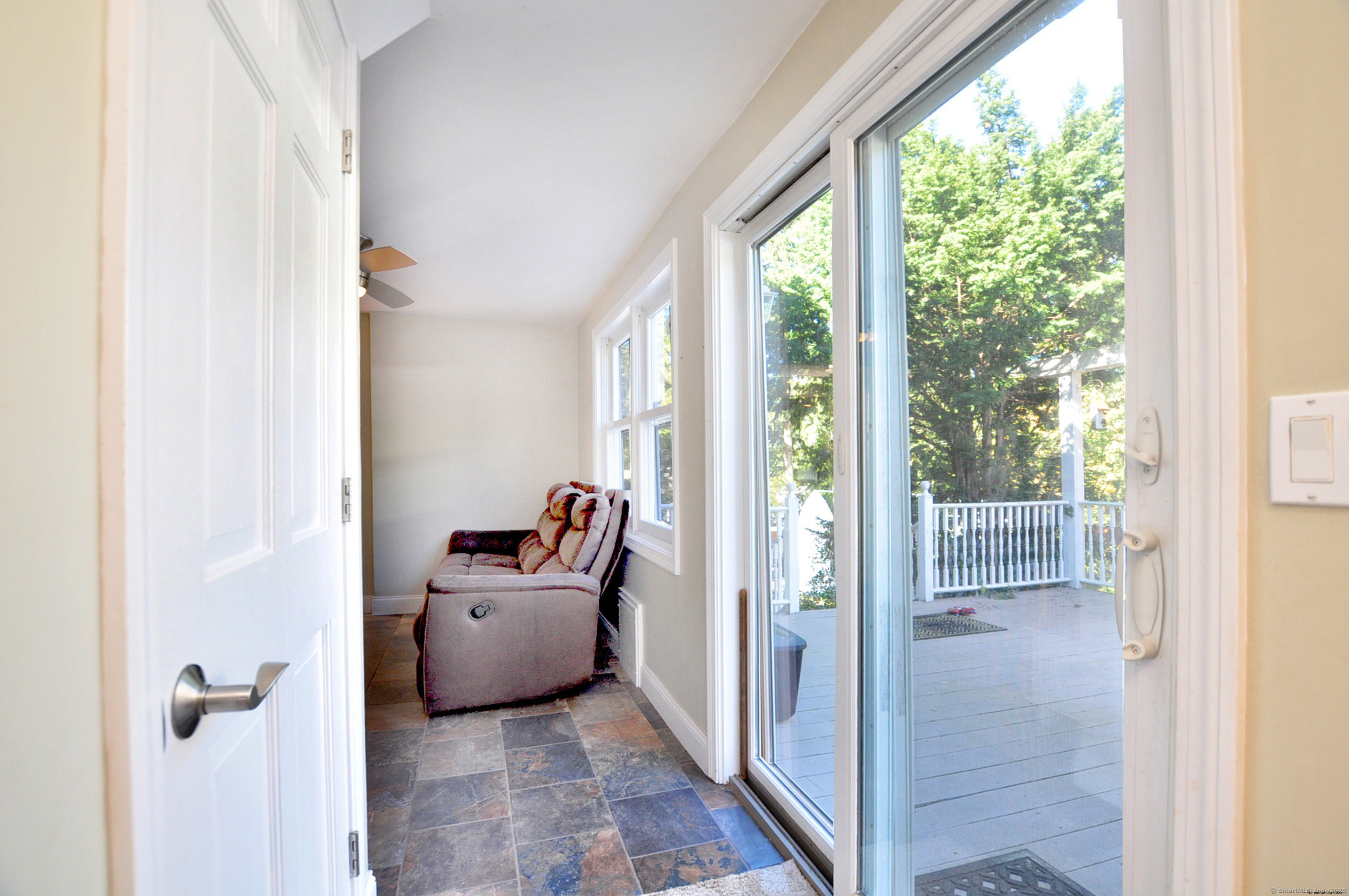 274 Smith Street South Windsor, CT 06074 - Photo 21 of 38 a living room with furniture and a floor to ceiling window