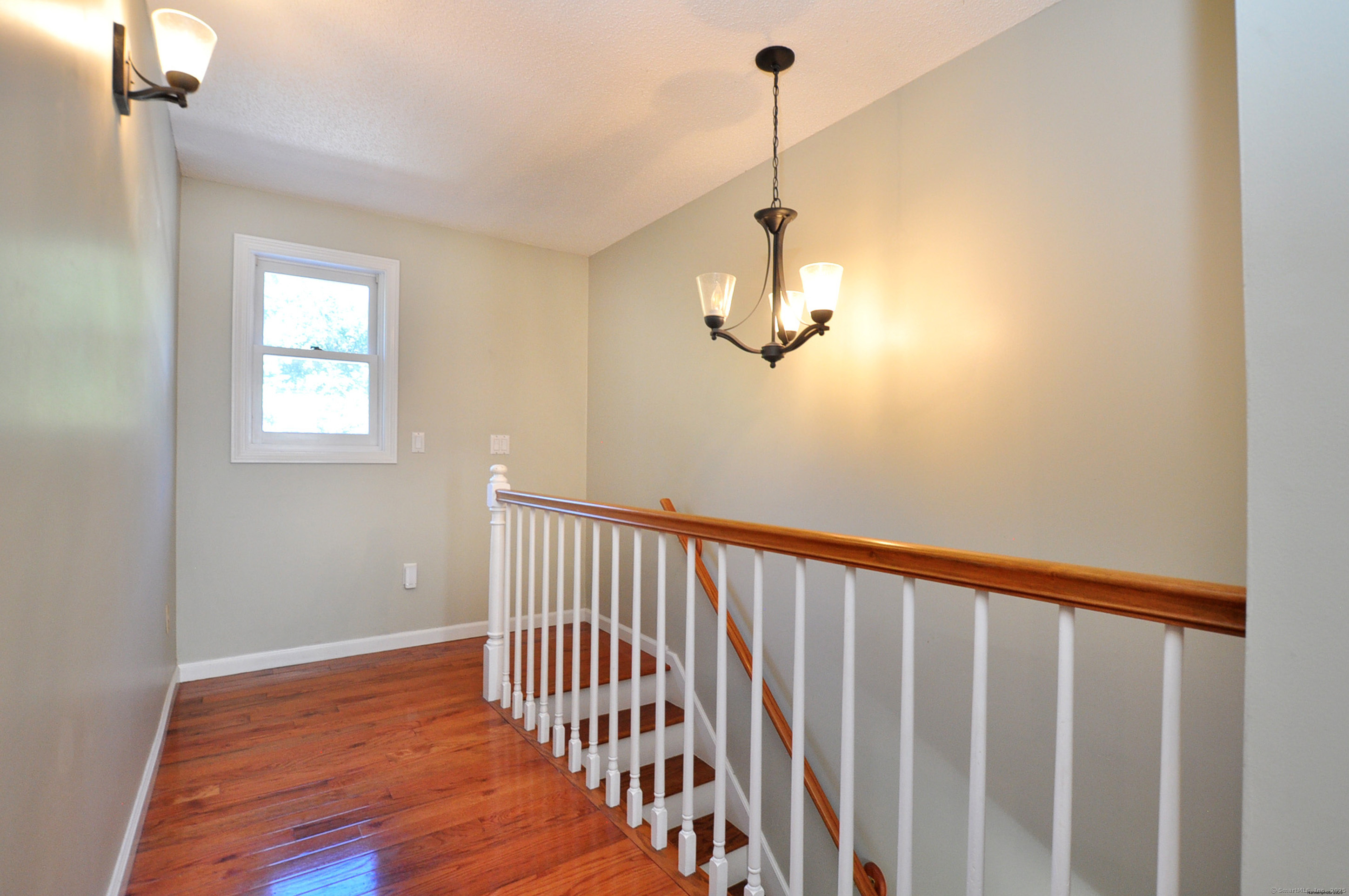 274 Smith Street South Windsor, CT 06074 - Photo 23 of 38 a view of a hallway with a window