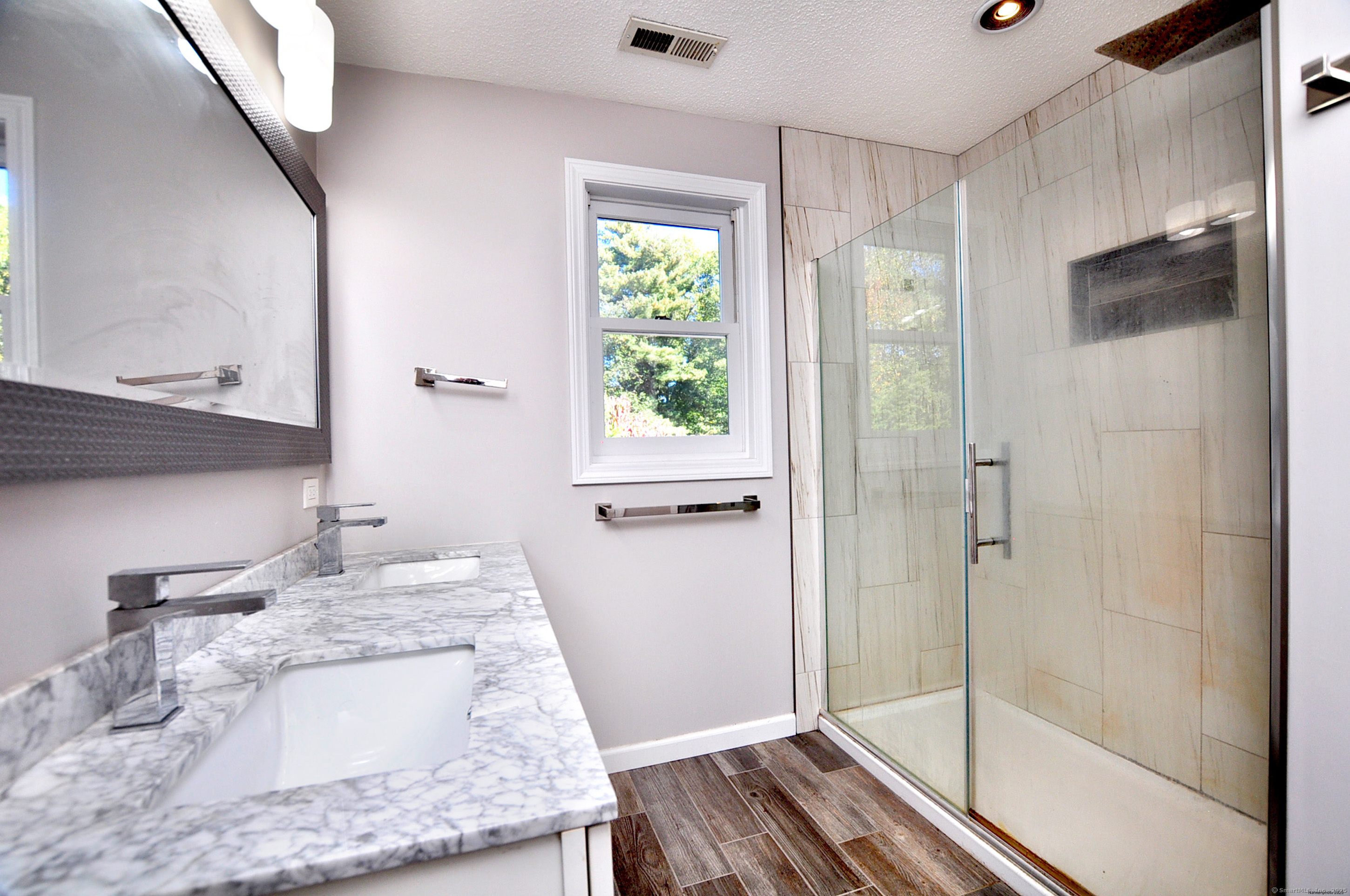 274 Smith Street South Windsor, CT 06074 - Photo 30 of 38 a bathroom with a granite countertop shower a mirror and a sink