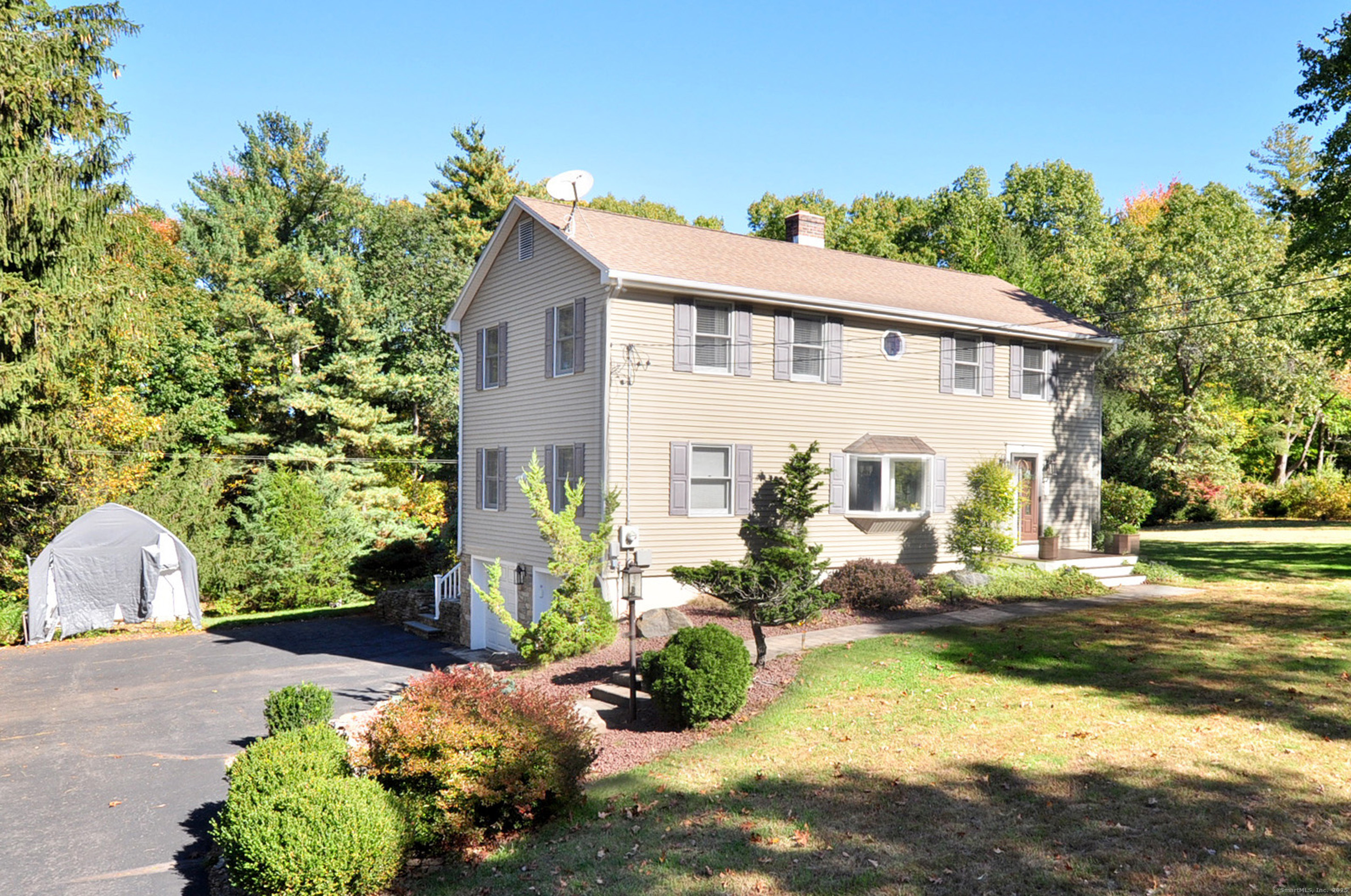 274 Smith Street South Windsor, CT 06074 - Photo 3 of 38 a front view of a house with a yard