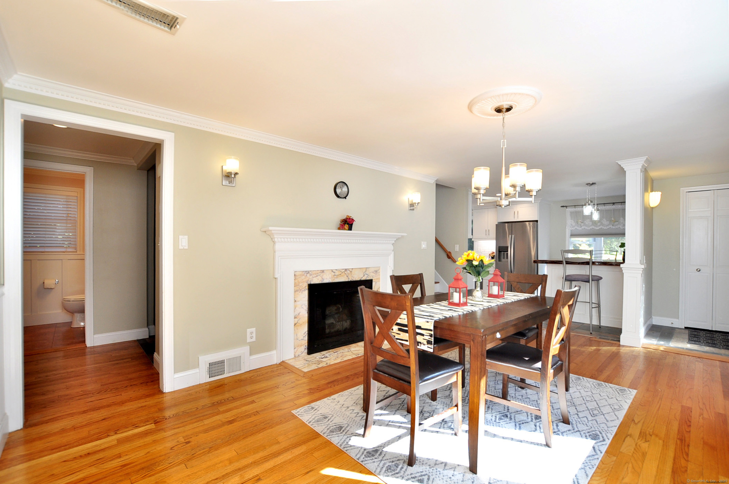 274 Smith Street South Windsor, CT 06074 - Photo 7 of 38 a view of a dining room with furniture and wooden floor