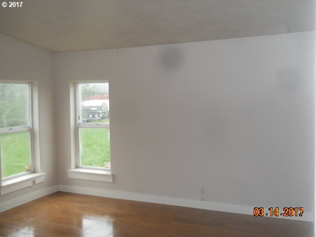 10045 South Prairie Road Tillamook, OR 97141 - Photo 15 of 24 an empty room with a window