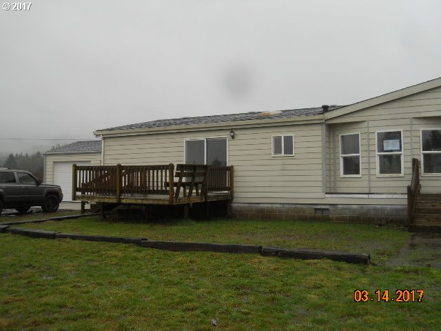 10045 South Prairie Road Tillamook, OR 97141 - Photo 2 of 24 a view of a house with a yard