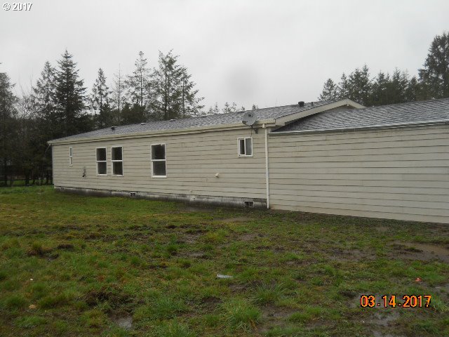 10045 South Prairie Road Tillamook, OR 97141 - Photo 6 of 24 a backyard view with a garden