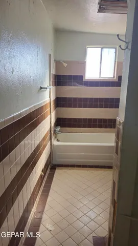 a view of a kitchen with a sink a window and stainless steel appliances