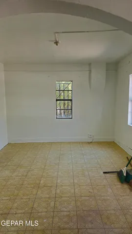an empty room with a empty space and a window