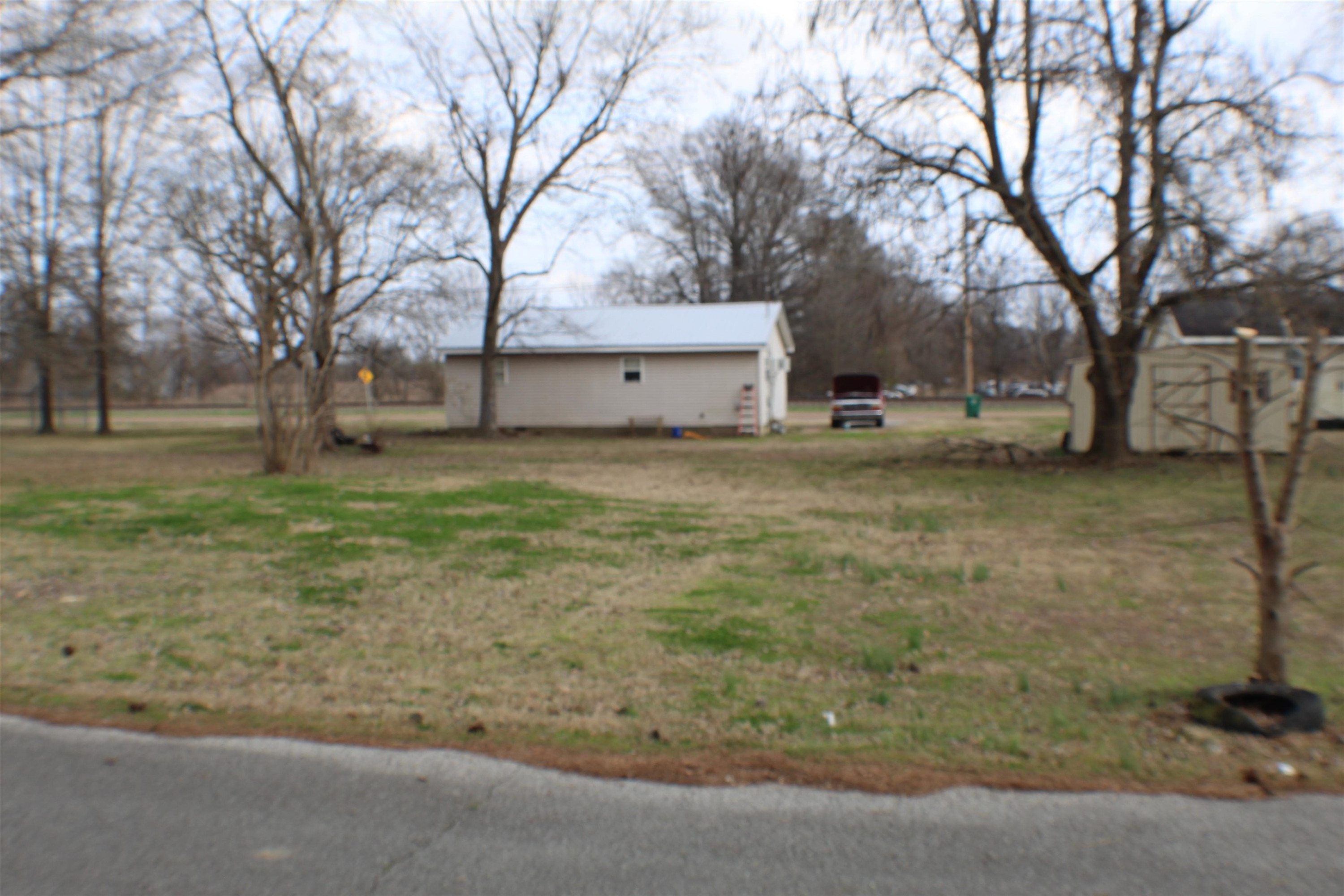36 Hamil Street Gates, TN 38037 - Photo 2 of 2 a house with trees in front of it