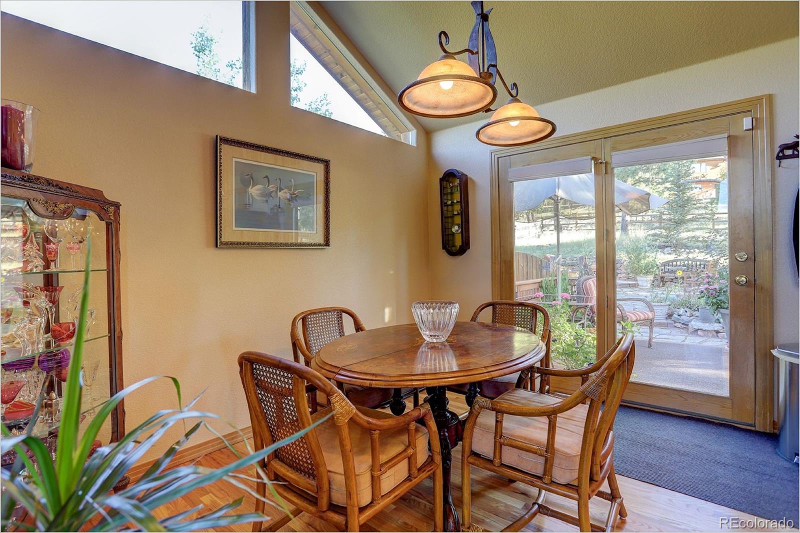 109 Royal Ridge Drive Bailey, CO 80421 - Photo 14 of 39 a dining room with furniture and window