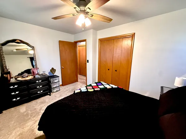 a bedroom with bed and window
