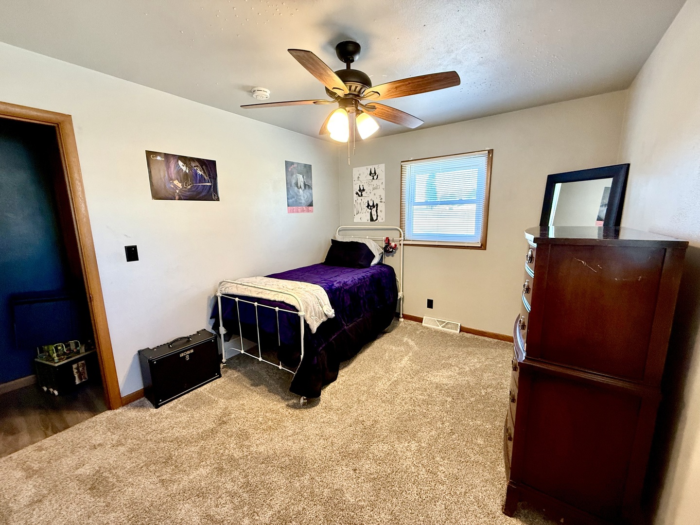 1703 24th Street Rock Island, IL 61201 - Photo 13 of 28 a bedroom with a bed and a dresser