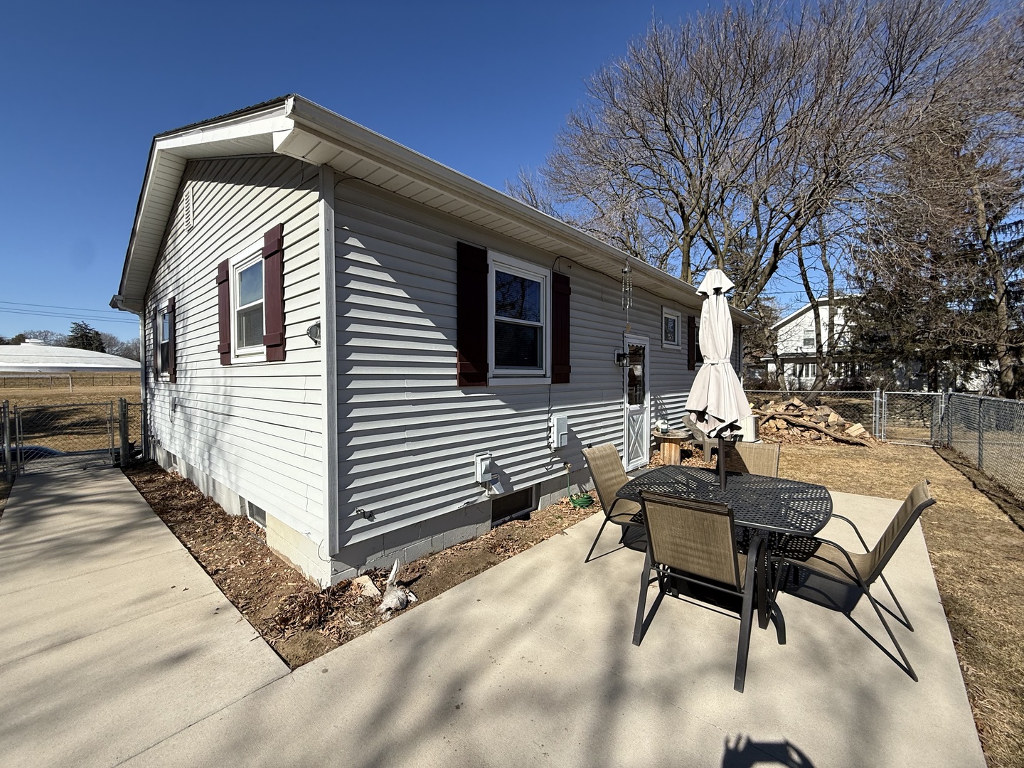 1703 24th Street Rock Island, IL 61201 - Photo 27 of 28 a backyard of a house with table and chairs