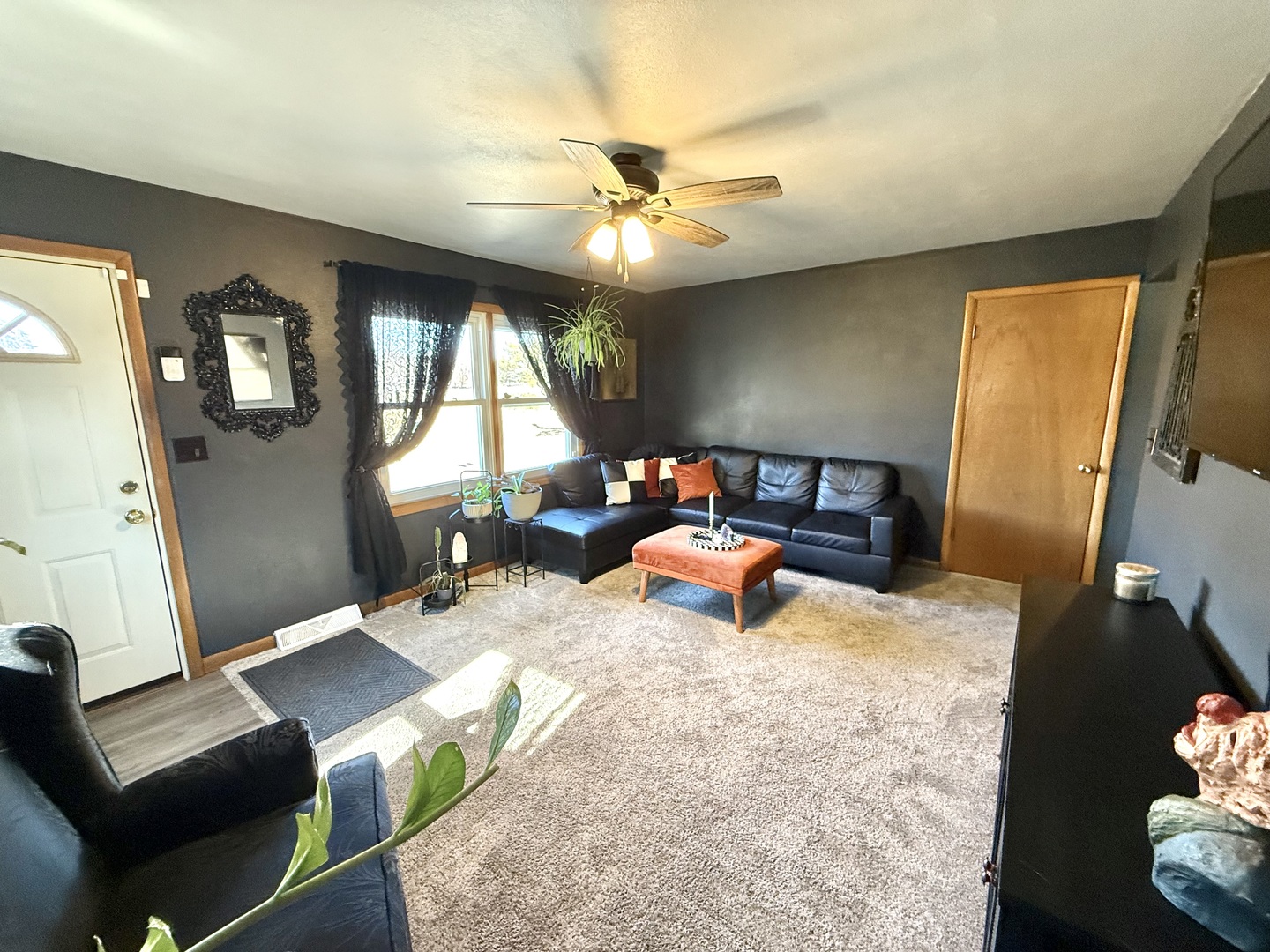 1703 24th Street Rock Island, IL 61201 - Photo 4 of 28 a living room with furniture and a flat screen tv