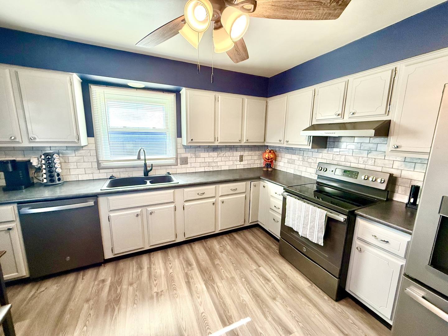 1703 24th Street Rock Island, IL 61201 - Photo 6 of 28 a kitchen with a sink stove and cabinets
