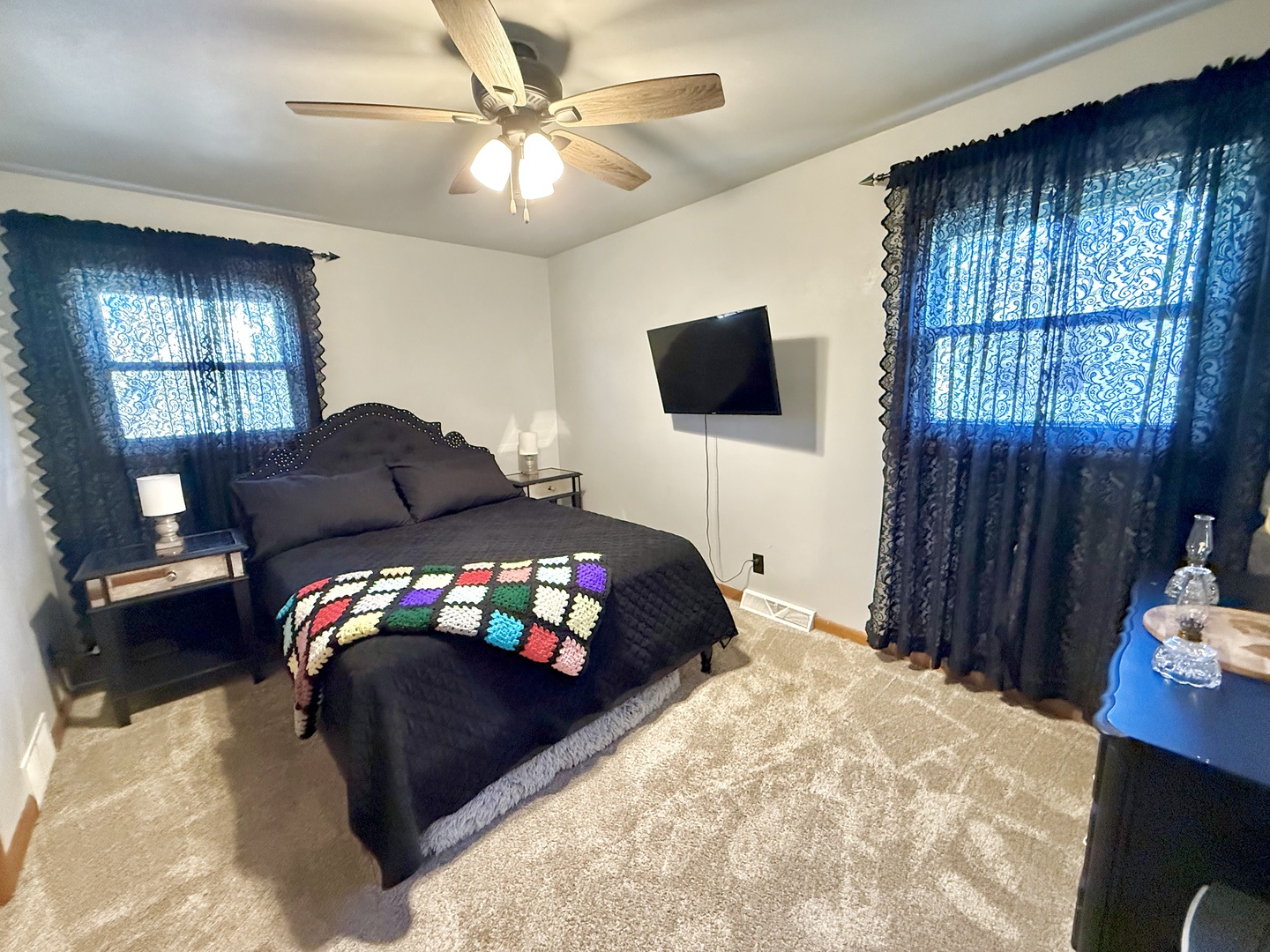 1703 24th Street Rock Island, IL 61201 - Photo 10 of 28 a bedroom with a bed window and a flat screen tv