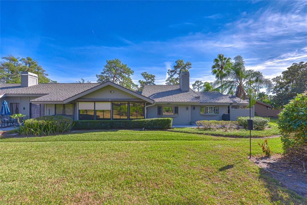 5355 Cobblestone Court Wesley Chapel, FL 33543 - Photo 11 of 54 a front view of a house with garden
