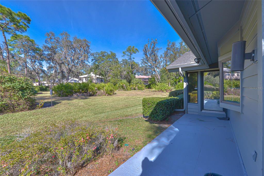 5355 Cobblestone Court Wesley Chapel, FL 33543 - Photo 15 of 54 a view of a garden with an outdoor space