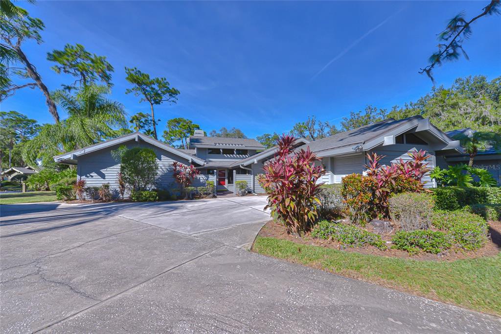 5355 Cobblestone Court Wesley Chapel, FL 33543 - Photo 2 of 54 front view of a house with a yard