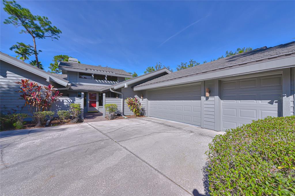 5355 Cobblestone Court Wesley Chapel, FL 33543 - Photo 3 of 54 a view of a house with a garage