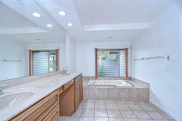 a view of a room with wooden floor and white walls