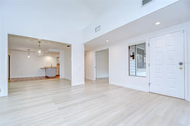 a bathroom with a granite countertop sink a toilet and a mirror