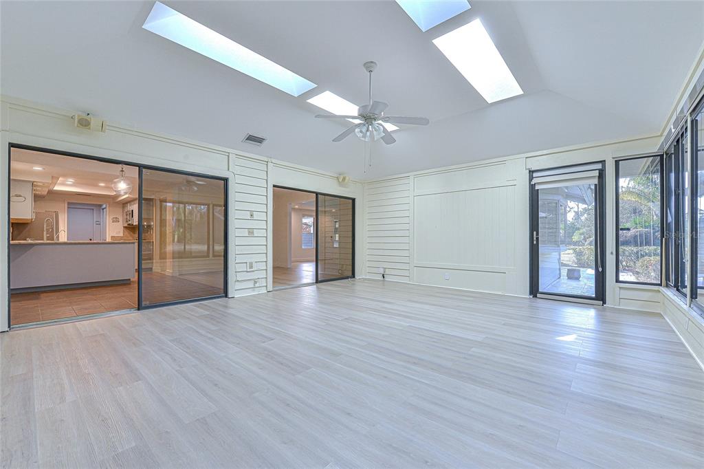 5355 Cobblestone Court Wesley Chapel, FL 33543 - Photo 35 of 54 a view of an empty room with window and wooden floor