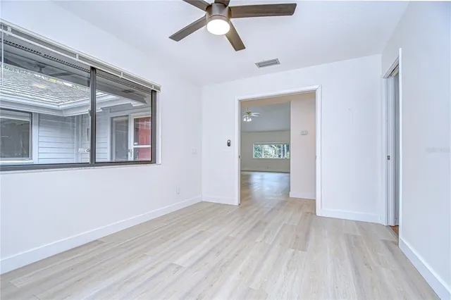 a view of a kitchen with stainless steel appliances granite countertop a stove and a sink