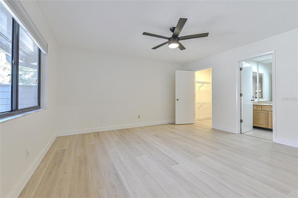 5355 Cobblestone Court Wesley Chapel, FL 33543 - Photo 41 of 54 a view of a livingroom with a window and wooden floor