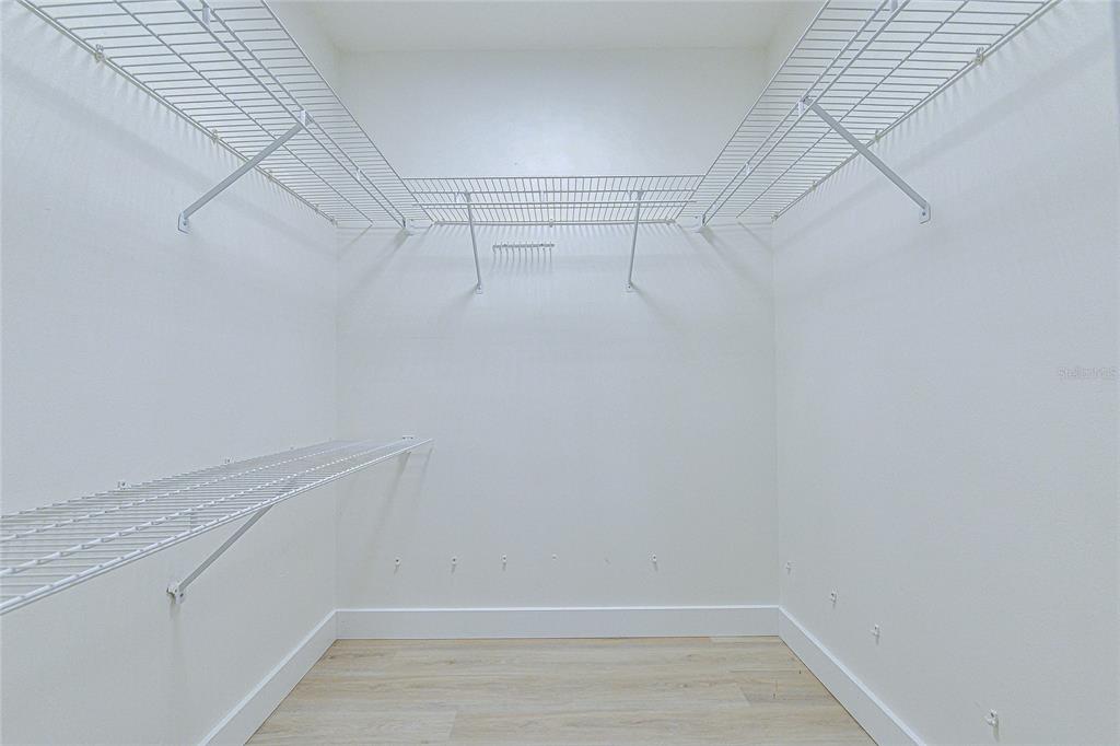 5355 Cobblestone Court Wesley Chapel, FL 33543 - Photo 45 of 54 a view of a room with racks on the wall