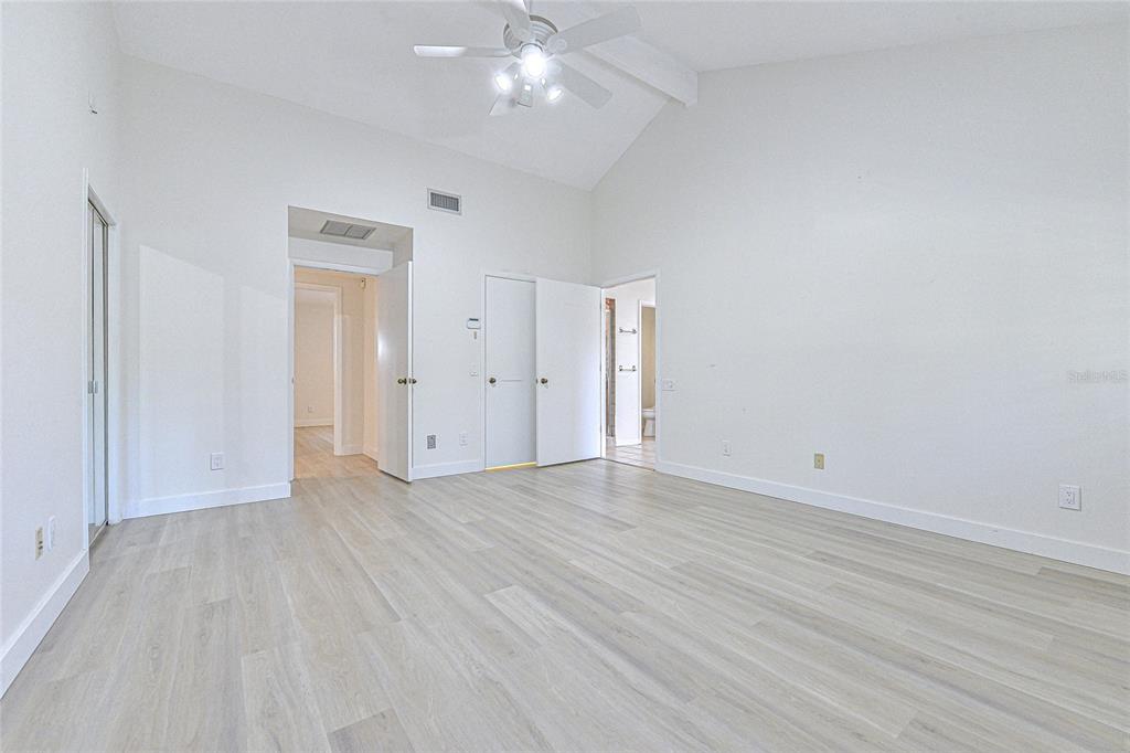 5355 Cobblestone Court Wesley Chapel, FL 33543 - Photo 50 of 54 a view of an empty room with wooden floor