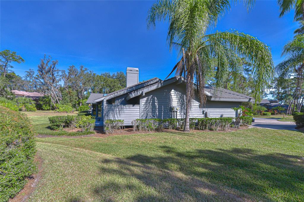 5355 Cobblestone Court Wesley Chapel, FL 33543 - Photo 7 of 54 a house view with a garden space