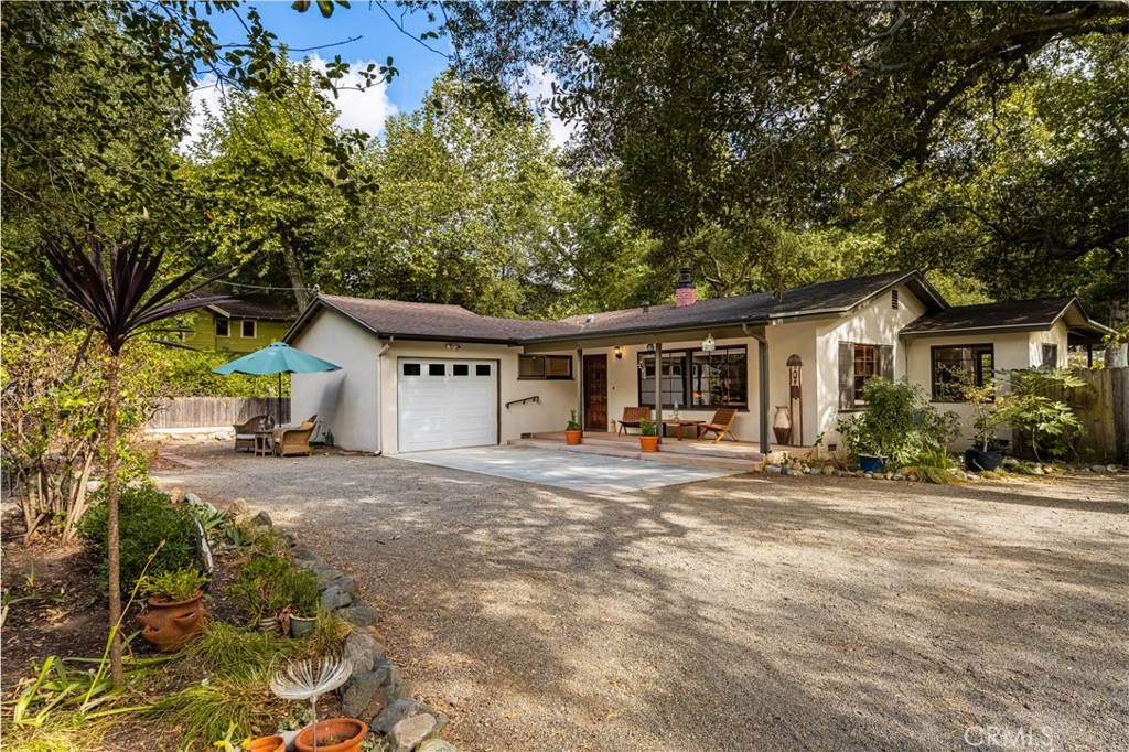 28872 Modjeska Canyon Road Silverado, CA 92676 - Photo 1 of 1 a front view of a house with a garden and trees
