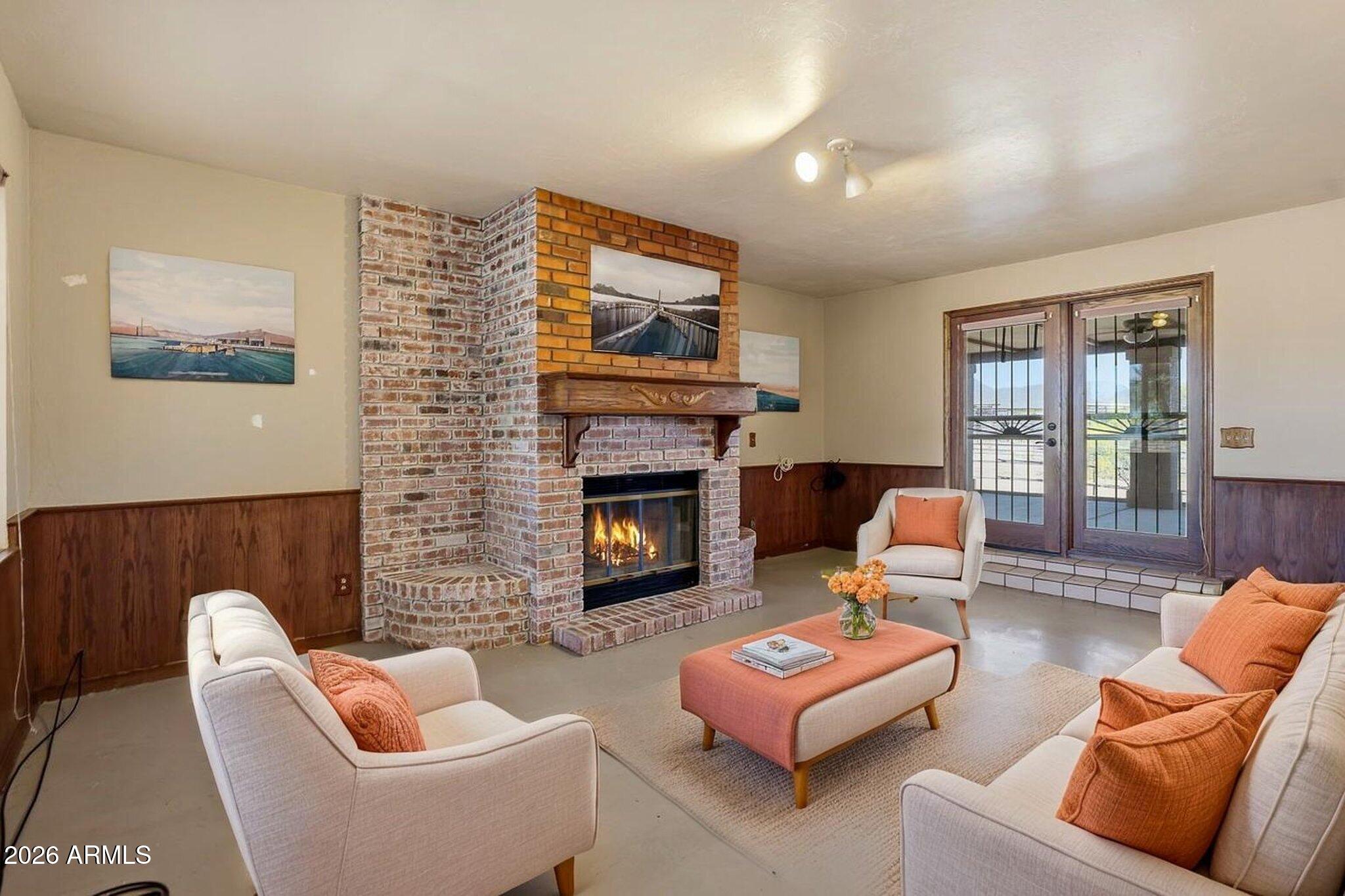 1302 East Maddock Road Phoenix, AZ 85086 - Photo 11 of 40 a living room with furniture and a fireplace