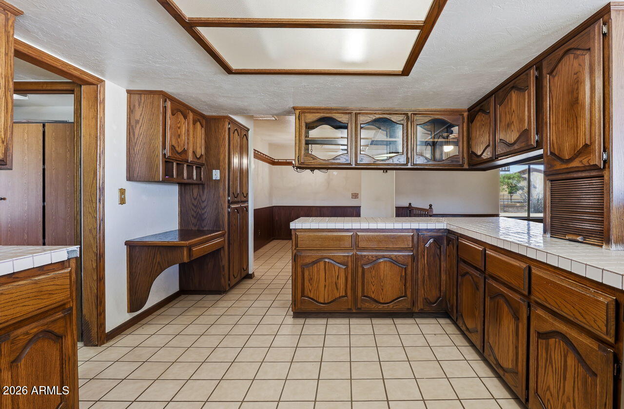1302 East Maddock Road Phoenix, AZ 85086 - Photo 13 of 40 a kitchen with stainless steel appliances granite countertop a sink and cabinets
