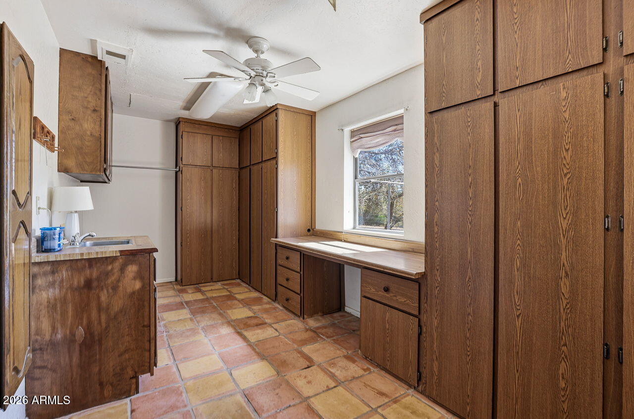 1302 East Maddock Road Phoenix, AZ 85086 - Photo 15 of 40 a kitchen with stainless steel appliances granite countertop a sink stove and refrigerator
