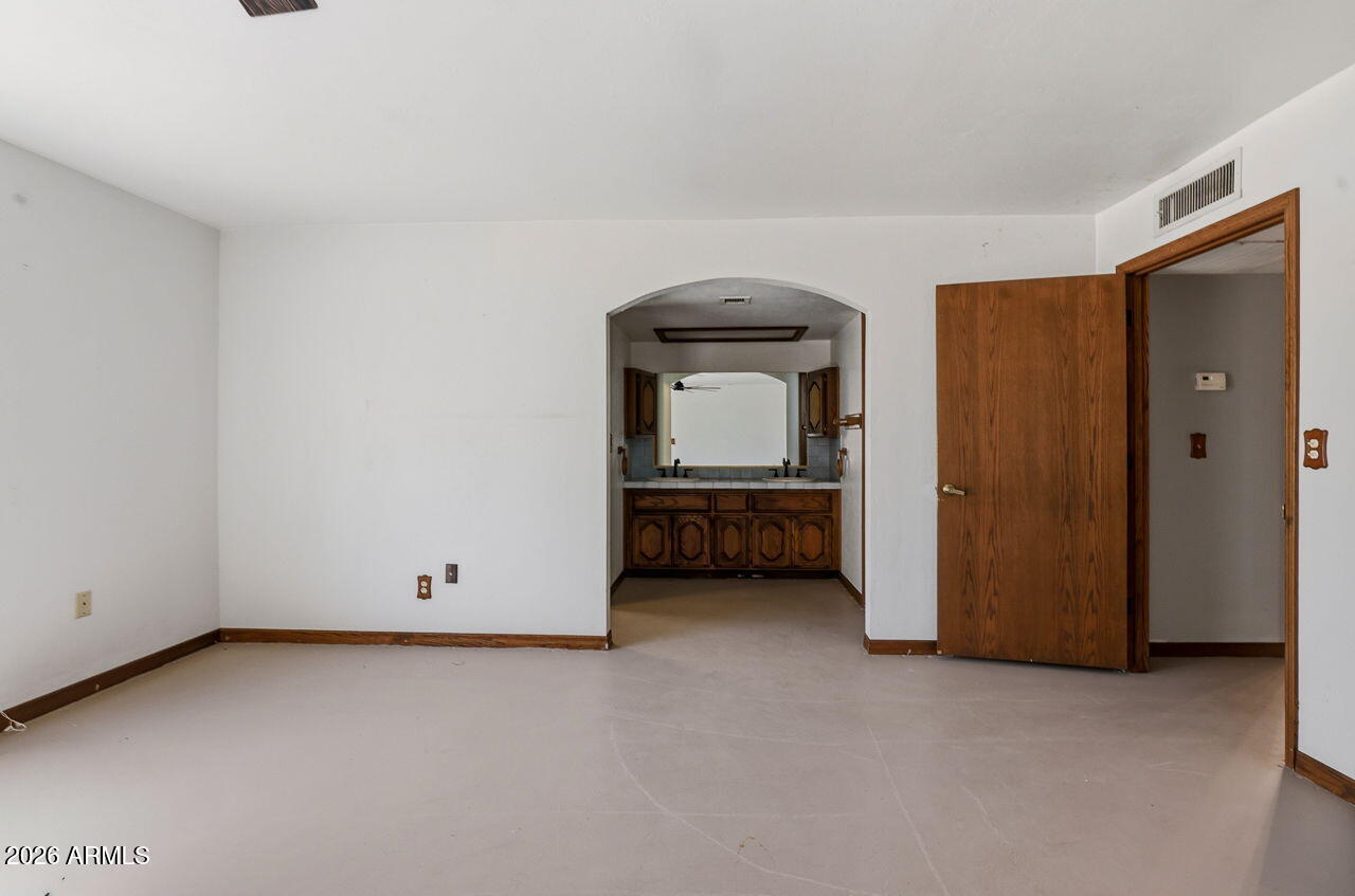 1302 East Maddock Road Phoenix, AZ 85086 - Photo 18 of 40 a view of an empty room and room with closet