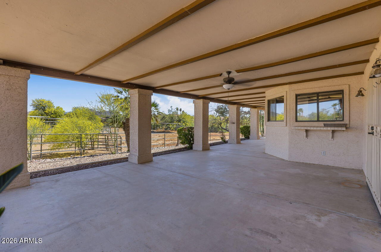 1302 East Maddock Road Phoenix, AZ 85086 - Photo 21 of 40 a view of an empty room with wooden floor and a window