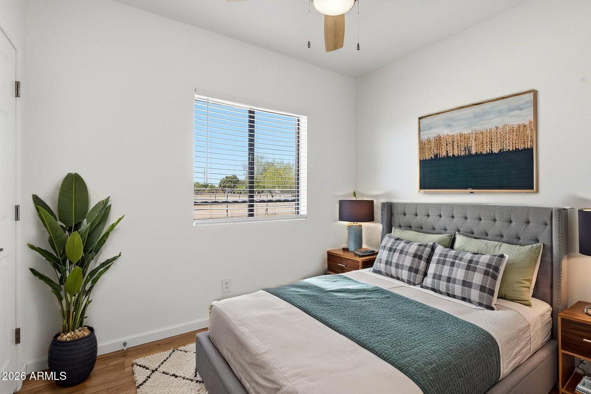 1302 East Maddock Road Phoenix, AZ 85086 - Photo 38 of 40 a bedroom with a bed and a potted plant