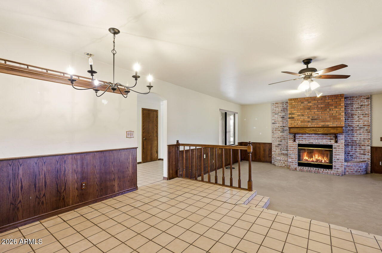 1302 East Maddock Road Phoenix, AZ 85086 - Photo 7 of 40 a living room with furniture and a fireplace