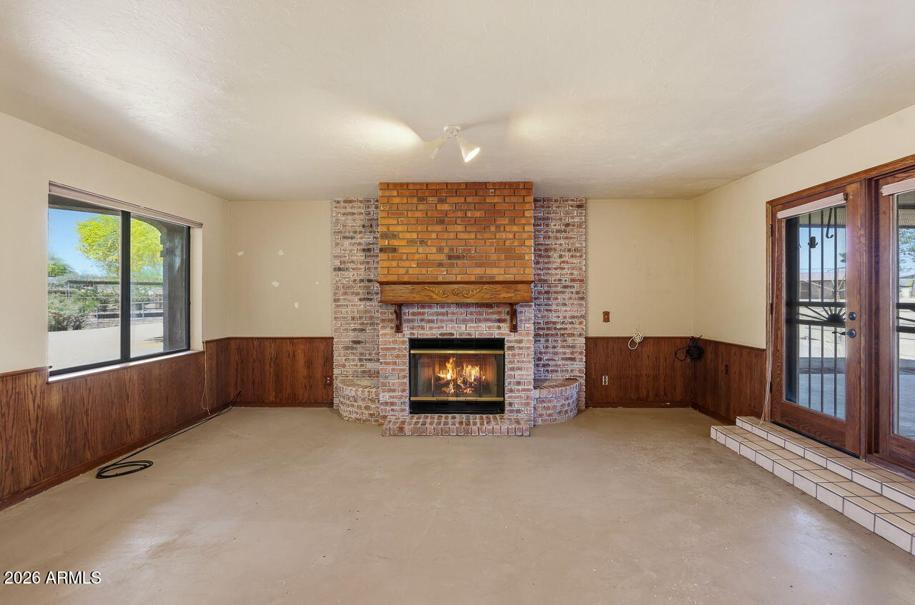 1302 East Maddock Road Phoenix, AZ 85086 - Photo 9 of 40 a living room with furniture and a fireplace