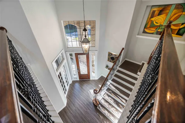 a view of an entryway with wooden floor
