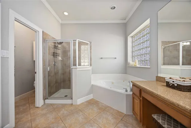 a bathroom with a tub shower and sink