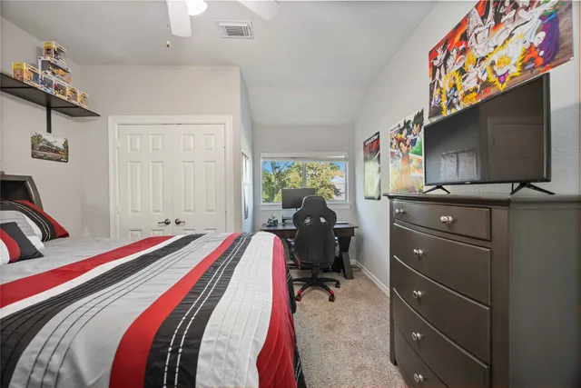 a en suite bathroom with a sink double vanity and mirror