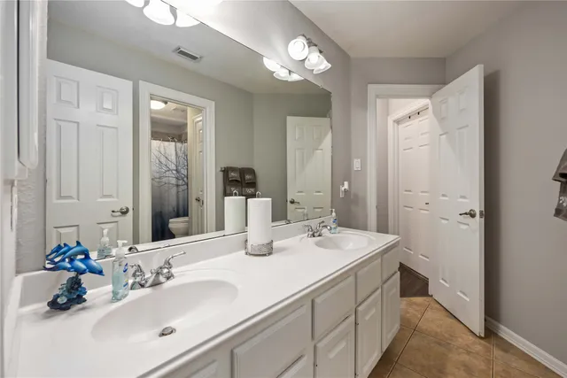 a bedroom with bed and window